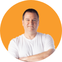 Image of a smiling white man in a white t-shirt.